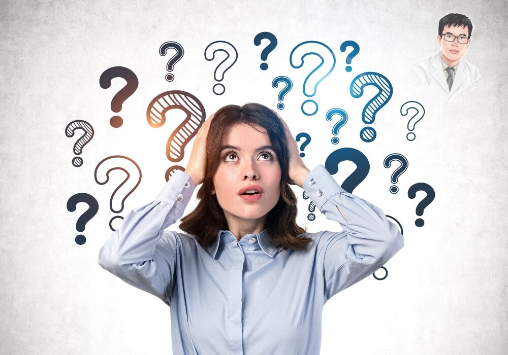  Người phụ nữ phân vân chi phí trồng răng implant bao nhiêu 1 cái.